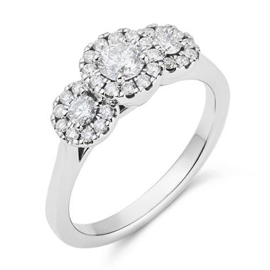 Platinum Graduated Diamond Halo Three Stone Ring thumbnail