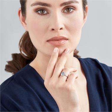 18ct White Gold Emerald Cut Blue Topaz and Diamond Halo Dress Ring thumbnail