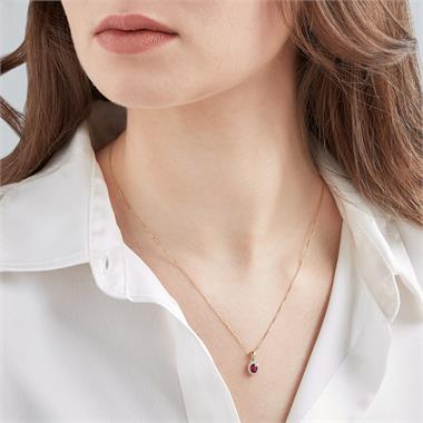 Camellia 18ct Yellow Gold Ruby and Diamond Oval Halo Pendant
 thumbnail