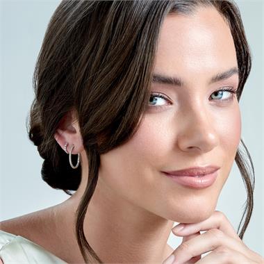 18ct White Gold Diamond Set Oval Hoop Earrings thumbnail