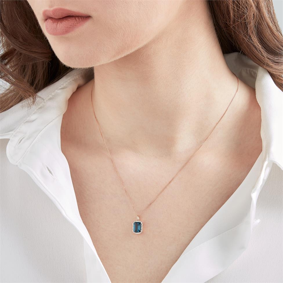 18ct Rose Gold Emerald Cut London Blue Topaz and Diamond Halo Pendant Thumbnail Image 1
